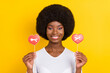 © deagreez - Photo of charming nice afro american young woman hold hands sweets addicted isolated on yellow color background