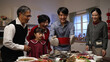© PRPicturesProduction - smiling asian father serving hot soup on the dining table and posing with folded arms, feeling proud of his cooking. preparing food for family on Chinese new year's eve