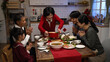 © PRPicturesProduction - happy grandmother serving delicious food on dining table as her family members clapping hands for her. getting ready for big meal on chinese new year's eve