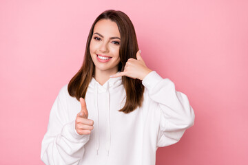 Wall Mural - Photo of young girl happy positive smile call phone point finger you sign isolated over pink color background