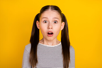 Poster - Photo of young school girl amazed surprised afraid scared fail mistake isolated over yellow color background