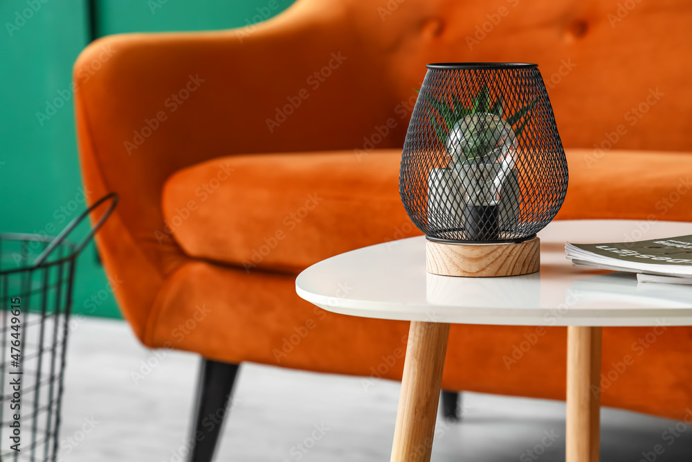 Stylish lamp on table in living room