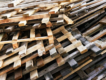 Piled Into A Heap Of Wooden Pallets