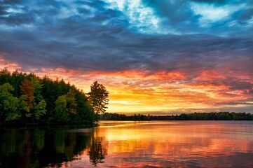 colorful sunset over summit lake in northern wisconsin.