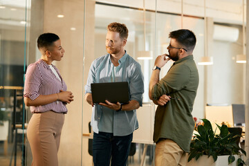 Wall Mural - Team of creative coworkers having business meeting while working in the office.