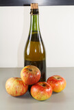 Fototapeta Most - Cider bottle and apples