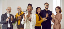 Kudos To You. Team Of Happy Respectful Business People Looking At Camera And Applauding. Multiracial Group Of Cheerful Smiling Adult Males And Females Clapping Hands. Point Of View Shot, POV Portrait