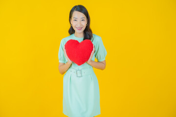 Poster - Portrait beautiful young asian woman smile with heart pillow shape