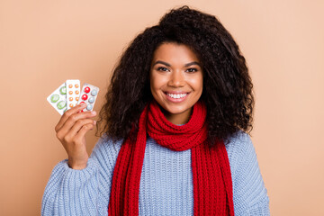 Sticker - Photo of young lovely woman hold pharmacy painkillers drug healthcare isolated over beige color background