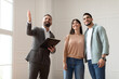 © Prostock-studio - Estate Agent In Suit Showing Buyers New Apartment