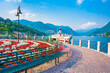 Romantic lakefront in Como harbour, tourist destination on Lake Como. The city contains numerous works of art, churches, gardens, museums, theatres, parks, and palaces
