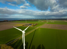 Wind Turbines In Green Fields