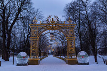 Golden Arch With Illumination In The Middle Of Trees In Winter In Wilanow Park Warsaw Poland