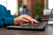 © DC Studio - Closeup of businessman hand analyzing management graphs typing company strategy on laptop keyboard working at marketing project. Executive manager planning business investment in startup office