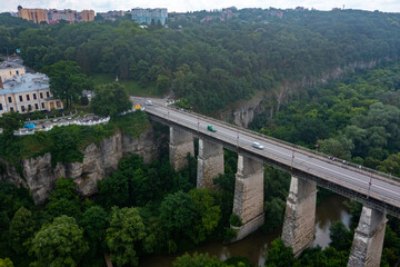Wall Mural - Aerial view of th ebeautiful bridge going over the green valley in Europe.