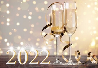 Wall Mural - 2022 New Year. Happy new year greeting card. Champagne glasses on glitter background