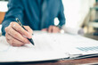 © Charnchai saeheng - Businessman working on office desk and analyzing new project of accounting finance. Investment, Financial advisor, budget, plan and accounting concept.