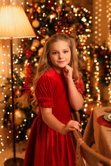 Wall Mural - Happy New Year! beautiful girl near the Christmas table