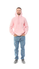Wall Mural - Young guy in stylish hoodie on white background
