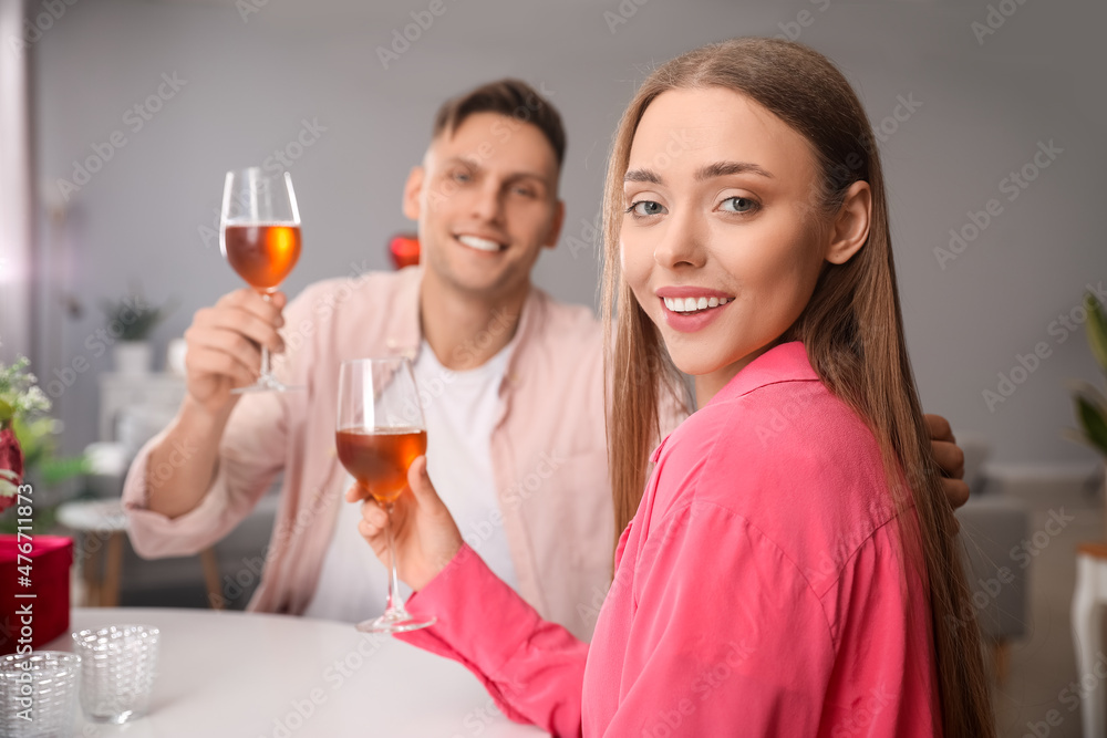 Happy couple celebrating Valentine's Day at home