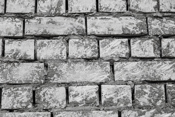 Brick wall in concrete as a background.