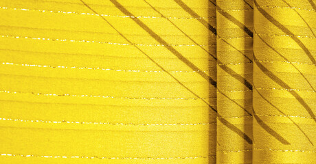 Design background texture, yellow amber fabric with lurex stripes, perfect for a fresh and comfortable style.