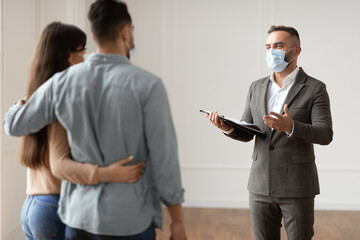 Sticker - Male Realtor In Medical Mask Showing Buyers New Apartment