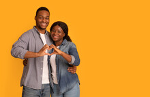 Portrait Of Happy Romantic Black Couple Making Heart Gesture With Their Hands