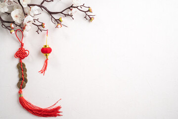 Chinese lunar new year background design concept with white plum flower and festive decoration.