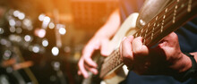 Close Up Hand Young Man Playing Electric Guitar At Recording Studio Rehearsal Base. Rock Music Band.