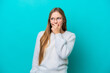 © luismolinero - Young Russian woman isolated on blue background having doubts and with confuse face expression