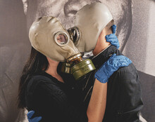 Man And Woman With Gas Mask