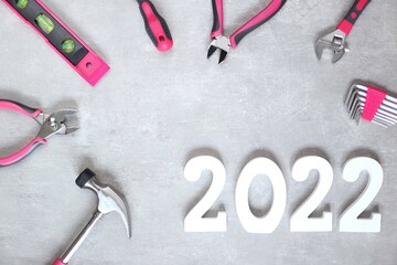 2022 flatly with various pink tools, copy space, banner