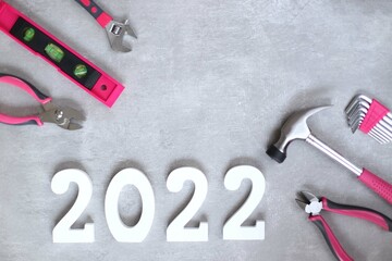 2022 flatly with various pink tools, copy space, banner