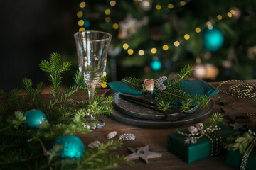 Wall Mural - Christmas table setting with black ceramic plate and gift boxes