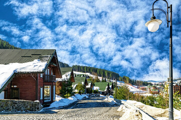 Wall Mural - Modern wooden cottage in a tourist winter resort in the mountains	