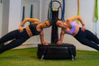 © DusanJelicic - Two young woman training while using power plate in a gym