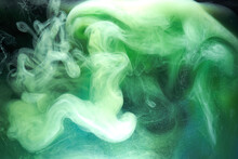 Green Smoke On Black Ink Background, Colorful Fog, Abstract Swirling Emerald Ocean Sea, Acrylic Paint Pigment Underwater