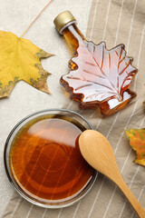 Wall Mural - Flat lay composition with tasty maple syrup and dry leaves on light grey table