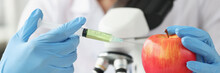 Doctor Scientist Makes Injection Into Apple In Laboratory