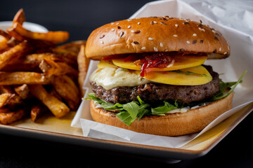 Wall Mural - details of tasty beef hamburger with gorgonzola cheese and fries