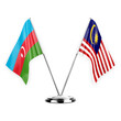Two table flags isolated on white background 3d illustration, azerbaijan and malaysia