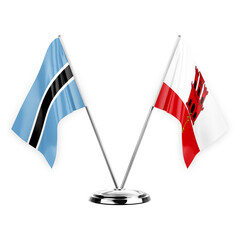 Two table flags isolated on white background 3d illustration, botswana and gibraltar