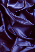 Bright Color Smooth Silk Background. Elegant Purple Satin With Waves. Fabric Backdrop, View From Above. Luxury Purple Cloth Texture. Prefect As An Abstract Background With Copy Space.