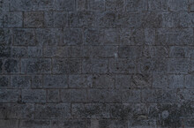 Irregular Dark Gray Bricks Dirty And Wet Wall Background 