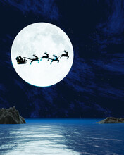 Silhouette Santa And Reindeer With Flying In The Dark Sky With Full Moon And Many Stars. The Concept For Christmas Eve. Super Moon Is Reflected In The Sea. A Wave The Ocean To The Island. 3D Rendering