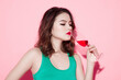 © makistock - Cheerful young asian woman drinking red wine.