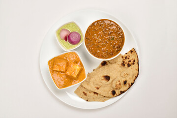 Wall Mural - Dal Makhani and Shahi Paneer Served with Roti in Plate isolated on white background