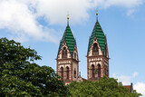 Fototapeta Big Ben - Twin towers of the Sacred Heart Church Herz-Jesu-Kirche in Freiburg im Breisgau, Baden-Wuerttemberg, Germany