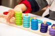 Baby toddler early development. Wooden stack and count rainbow colors learning game. Child learn colors and numbers
